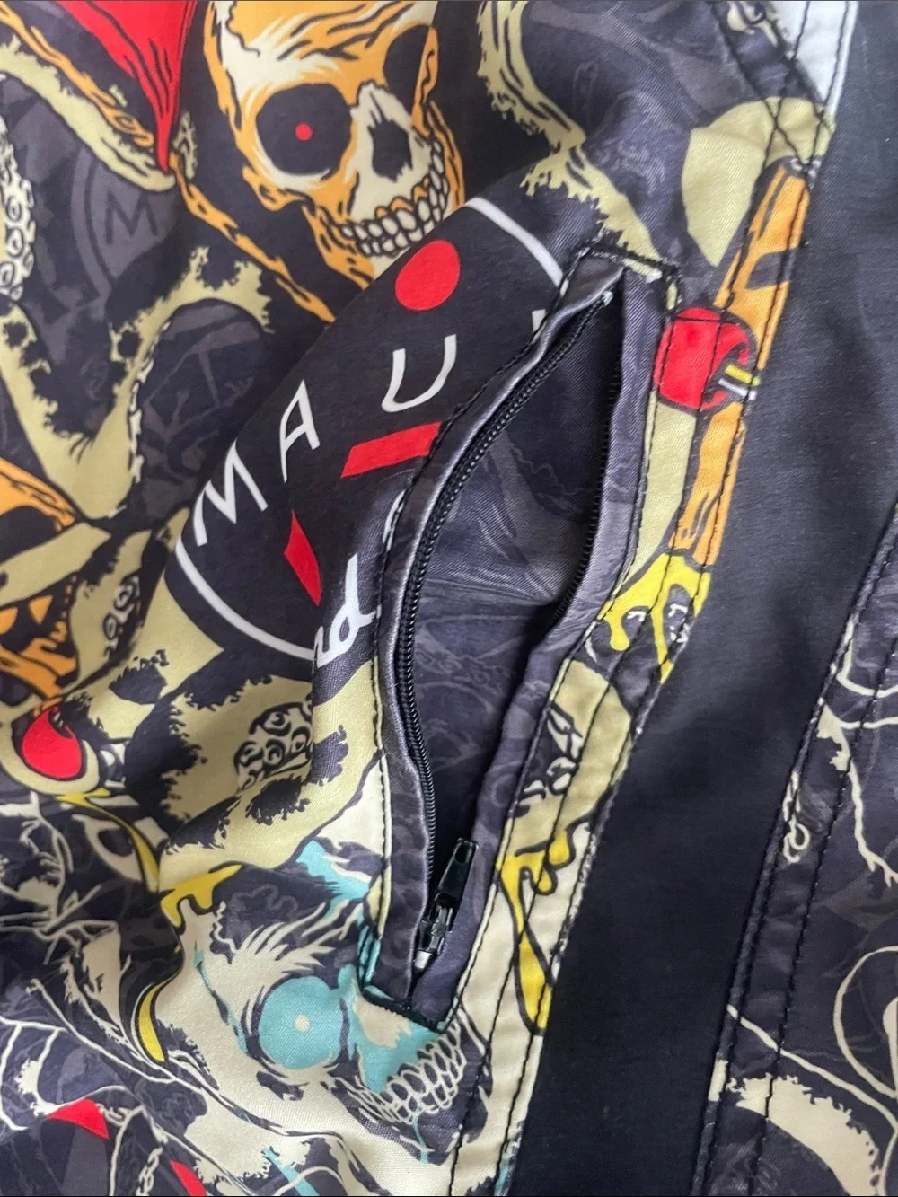 Maui and Sons Black Swim Shorts with Red & Yellow Skull Graphic